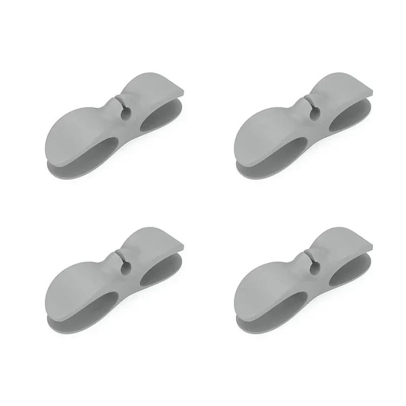 SecureCable clips securing multiple cables along a desk edge – tidy workspace