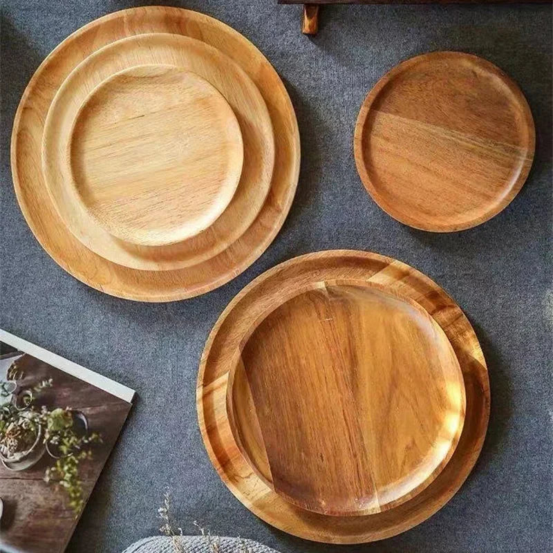 Close-up of acacia artisan plate showing wood grain and natural edge finish