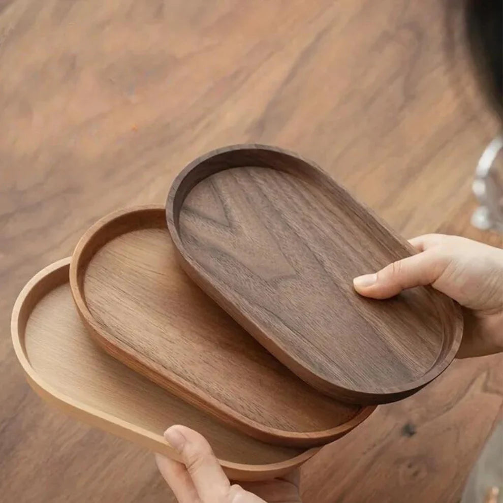 Oval Elegance wooden serving plate with charcuterie and cheese arranged on top