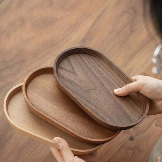 Oval Elegance wooden serving plate with charcuterie and cheese arranged on top