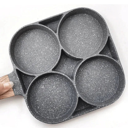 Multi-section frying pan with 4 moulds cooking eggs and bacon simultaneously