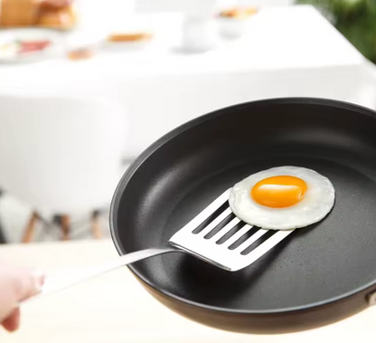 Precision spatulas in use folding batter in a mixing bowl – baking kitchen set