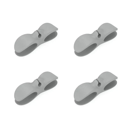 SecureCable clips securing multiple cables along a desk edge – tidy workspace