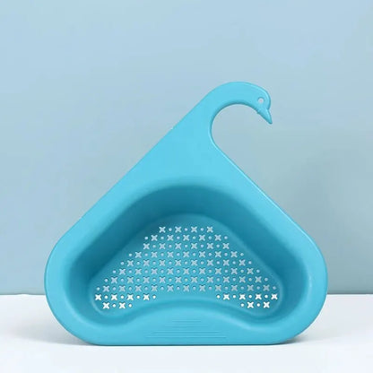 Kitchen sink organiser with brushes and soap on a white worktop