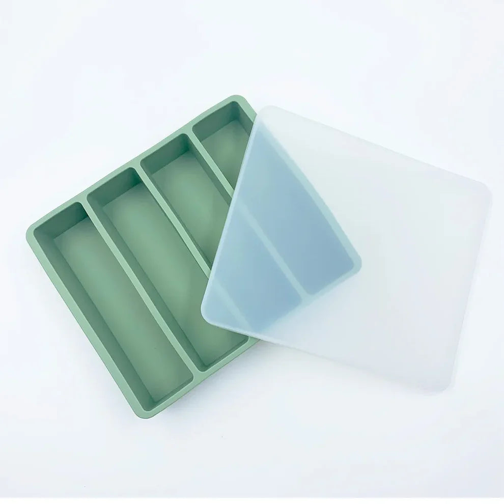 Multiple silicone trays stacked in a freezer – space-saving food storage trays