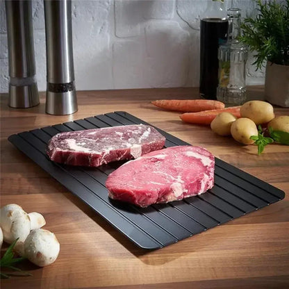Express defrosting tray with a frozen steak placed on top – rapid thaw kitchen tool