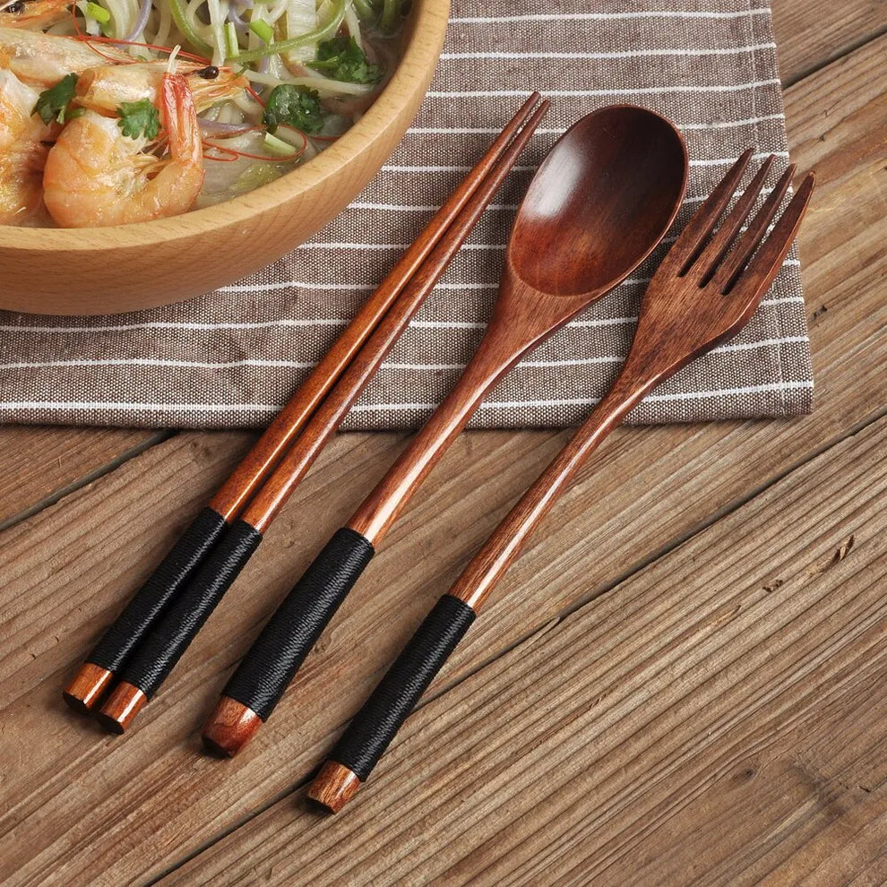 Full artisan cutlery set arranged neatly on a linen cloth – elegant table setting