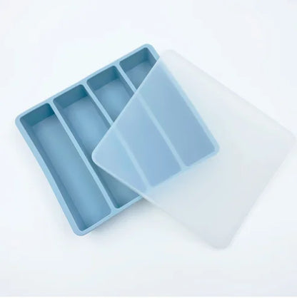 Close-up of silicone tray compartments showing flexible material – leak-proof design
