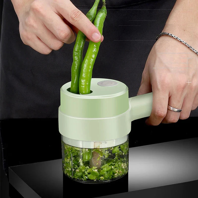 Cordless 4-in-1 electric food chopper chopping vegetables on a kitchen counter