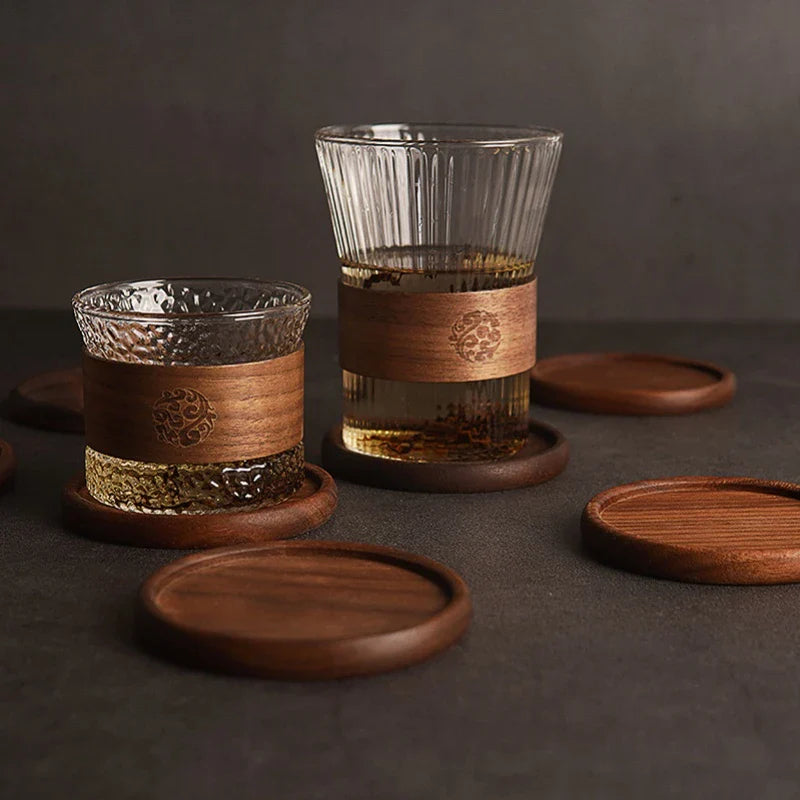 Four round acacia wood coasters stacked neatly – eco-friendly kitchen accessory
