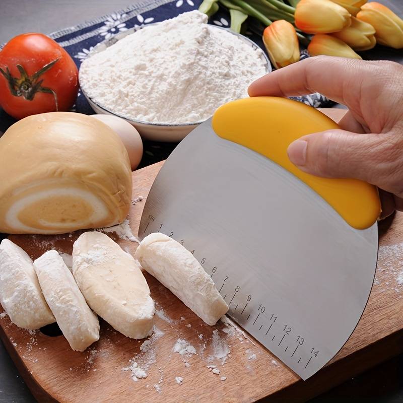 Dough cutter with ruler measuring pastry on a floured surface – baking precision tool