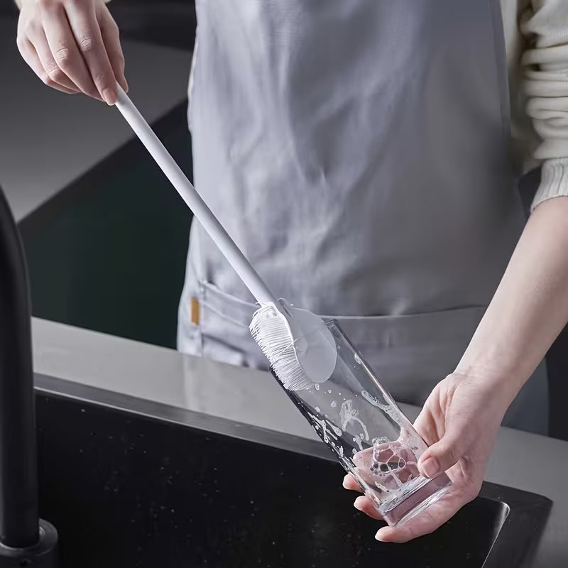 Siliclean silicone scrubber in use cleaning a non-stick pan – gentle dish cleaner